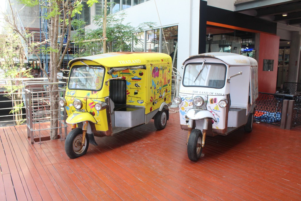 A couple of tuk-tuks, motorized rickshaws. These have been adapted as ice cream trucks.