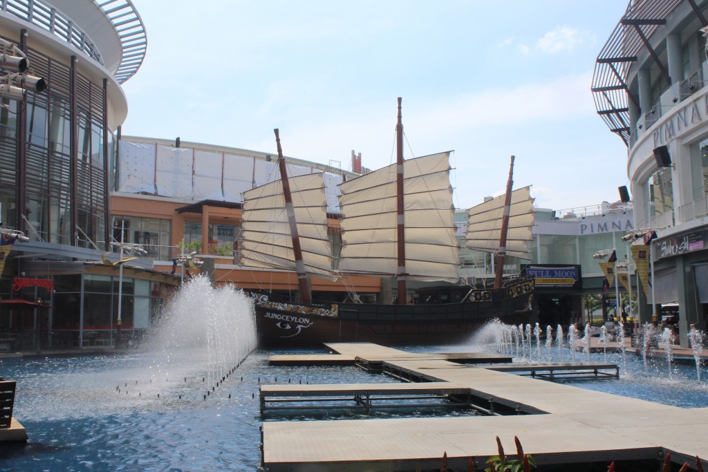 A replica of a Chinese junk and a pool and fountain were some of the features in the mall's open air courtyard.
