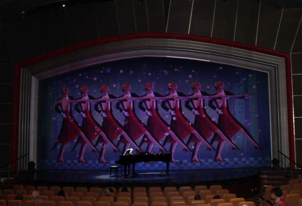 Many cruise ships have large theatres and provide nightly shows.