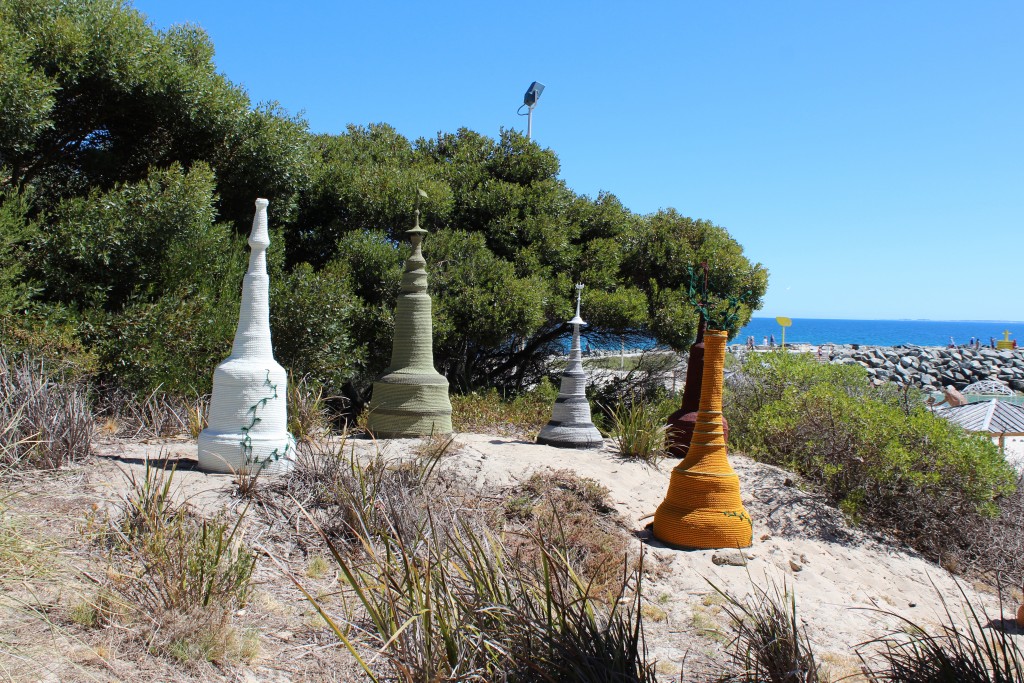 These sculptures look like giant chess pieces. They are knitted fabric.