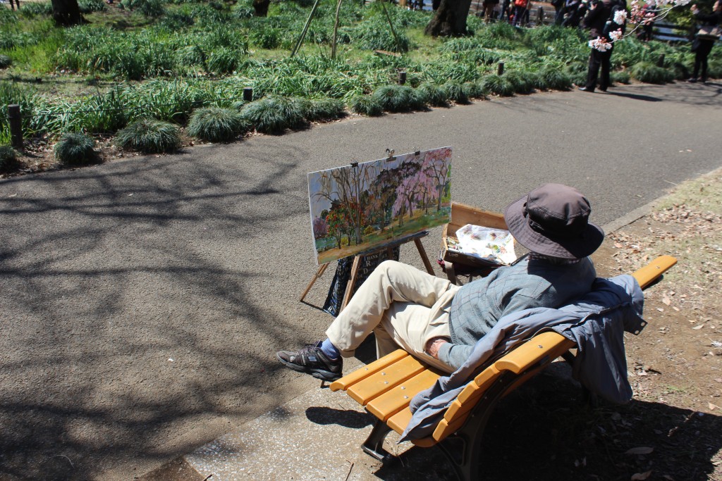 This artist was painting in colour. Looks like he was finished, but a minute after I took the picture, he dipped  his brush into some paint, added one brush stroke, then paused to think some more.