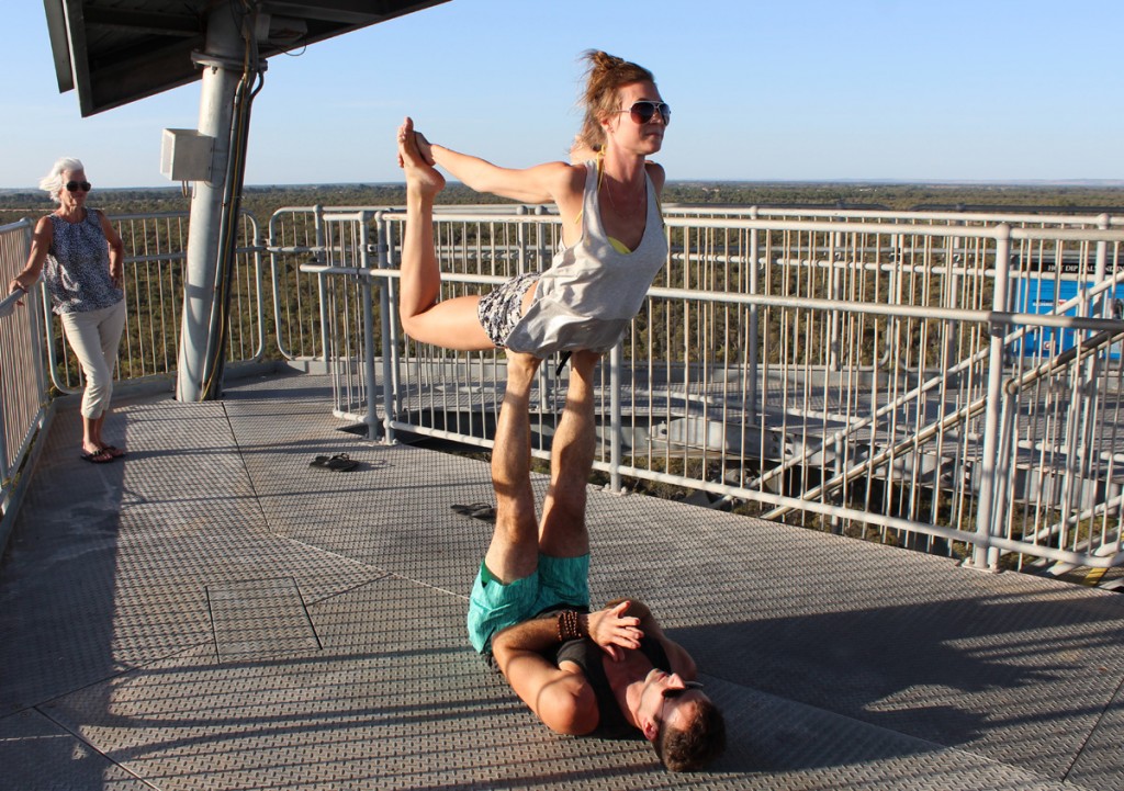 Sarah and Jamie striking a yoga pose on top of the Leaning Tower.